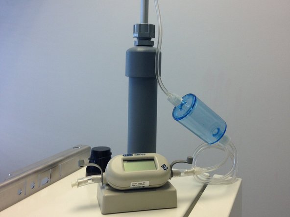 Attach the flow assembly to a 0-2.5 LPM volumetric flowmeter.