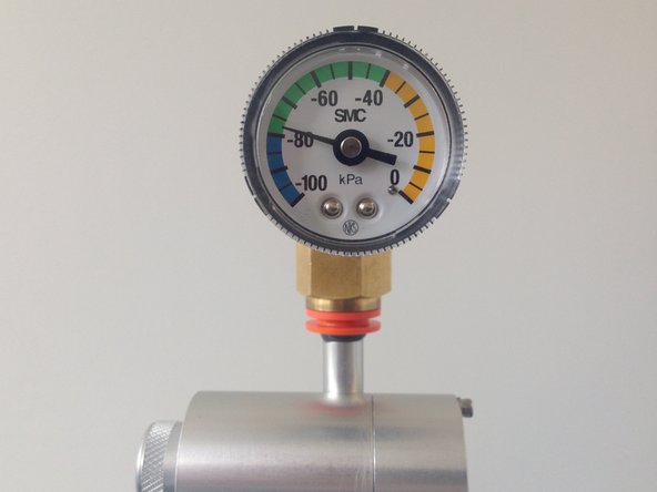 Remove the TSP head and install the vacuum gauge above the sharp cut cyclone.