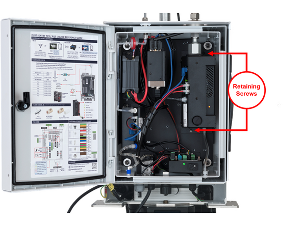 Loosen the two screws at the locations shown, which will allow the module to slide down.