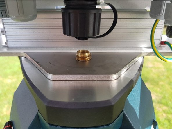 Attach the monitor to the tripod by screwing the tripod’s mounting screw through the threaded hole in the mounting plate.