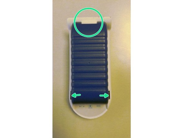 Re-engage the top hinge of the cover, swing it down and shut it into place.