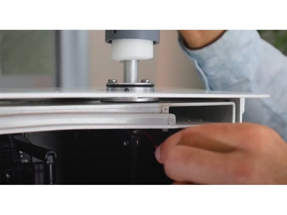 Carefully thread the aluminum inlet tube, as well as power cable and plug for the heater, through the mounting ring