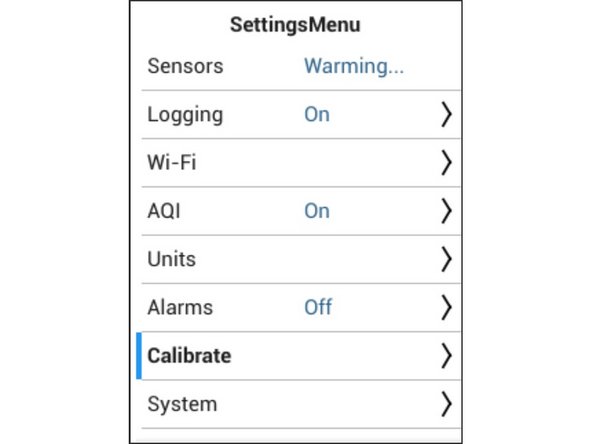 Enter the Settings menu by pressing and holding the LEFT ARROW