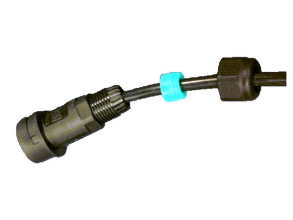 Thread the plug components over the power cable in the following order: nut gland, soft green gland, connector.