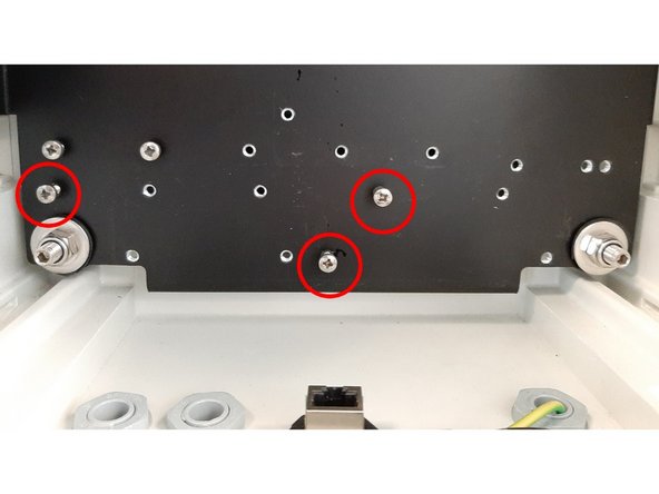 If there are any cable saddles on the underside of any modules on the bottom row of the instrument (as shown) remove them to make room for the PDI assembly.