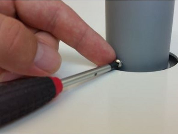 Align the holes in the grey tube with the holes in the aluminum mounting ring.