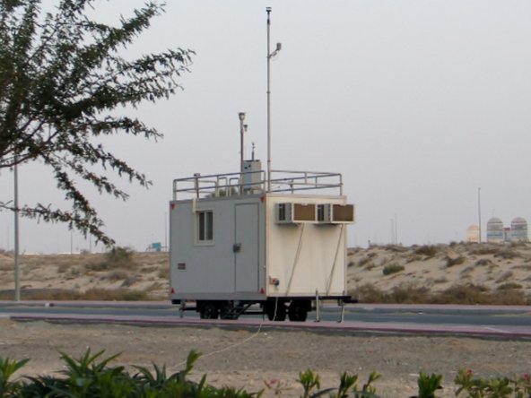 In this installation, the monitor is fixed to railing on the roof of a mobile trailer. A separate pole supports the wind sensor.
