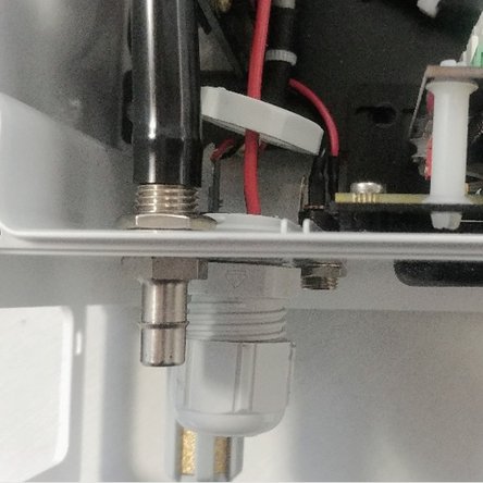 Insert the new DC connector assembly and thread wires through the new retaining nut.