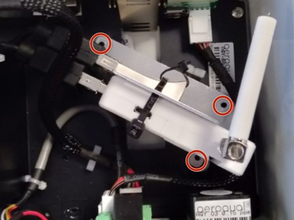 Reconnect the USB backup and modem to their USB cables and screw the bracket back onto the backplate.