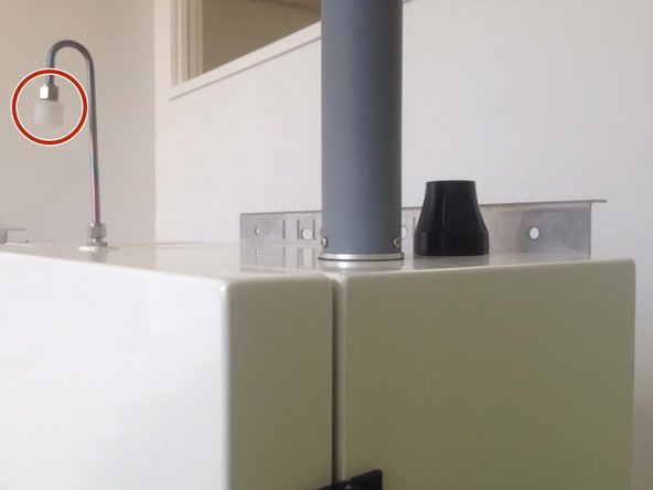 Fit the supplied Kynar fitting to the Swagelok nut at the end of the sample cane. This fitting contains the mesh filter.