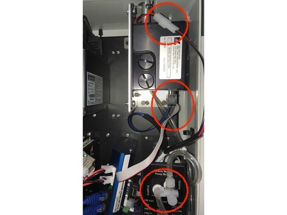 Prepare the module to be removed by disconnecting the tubing and cables: