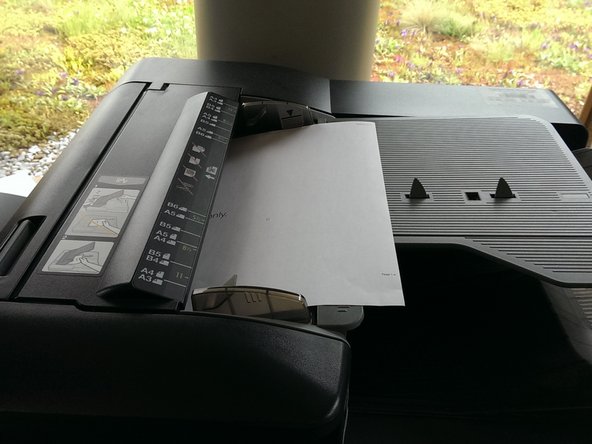 Insert the paper you want to scan here