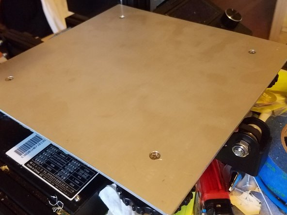 For me this meant pulling the four binder clips off of the corners and then removing the whole thing