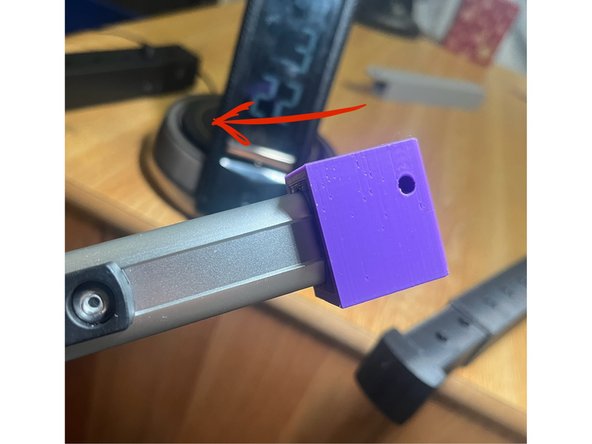 Place one of the inner/outer box combinations on the end of one of the front pylons of the wheelchair so that the hole in the inner box fits over the pylon.