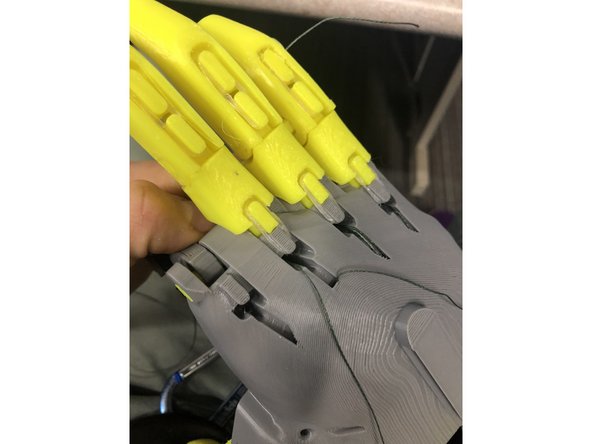 Tie off a string at the thumb and slide it in the same way as the other fingers.