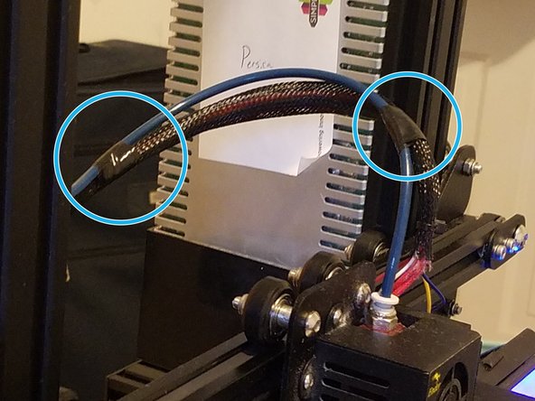 Use Electrical tape or zip ties to secure the wiring for the hot end electronics to the bowden tube so the both are angled together and neatly out of the way of the print bed.