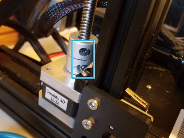 Loosen the two screws on the stock adaptor, then simply pull up on the lead screw, causing the piece to separate from either the printer itself, or the screw.