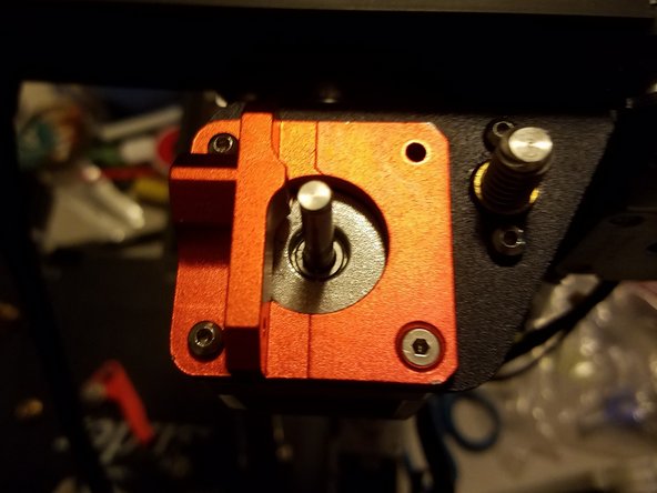 Place the motor and its frame against each other, then tighten the screws through the frame and into the four attachment points on the motor.