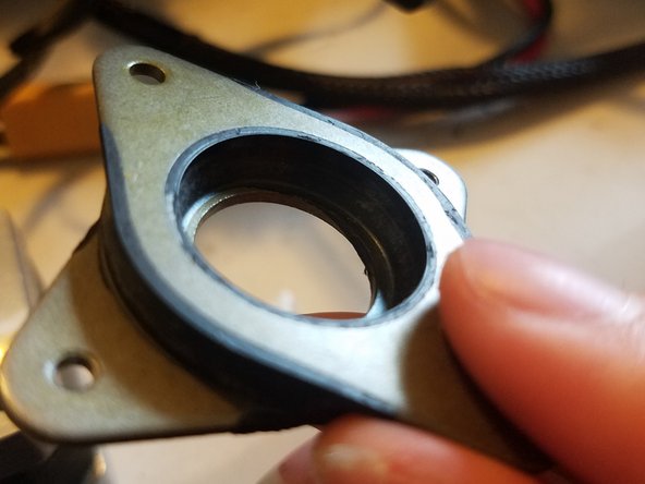 Place the sunken side of the damper onto the stepper motor so that the raised section on the other side faces upwards.