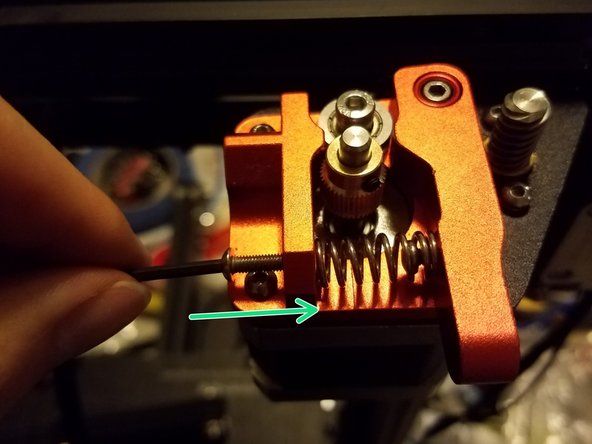 Then take another rounded hex screw from the stock frame and tighten it into the outside hole.