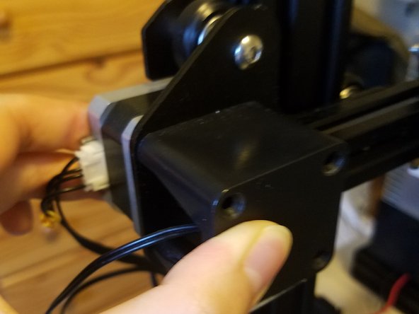 Warning: This motor is also under belt tension, as well as potentially being significantly higher off the table than the Y axis motor