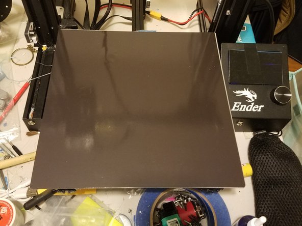 If you have a print bed with a component that’s glued on like this new magnetic print bed, you won’t be able to access the screws without either damaging the bed, or the adhesive.