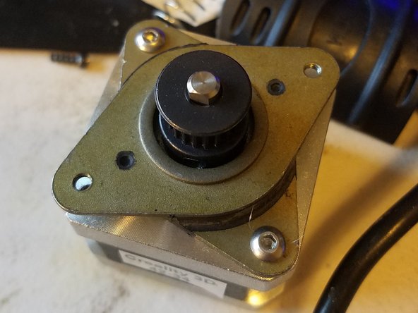 Attach the damper to the motor using the two screws you took from the Y axis motor.