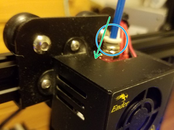 Safety note: While doing this, hold onto the fan housing and not the gantry arm to avoid burning yourself