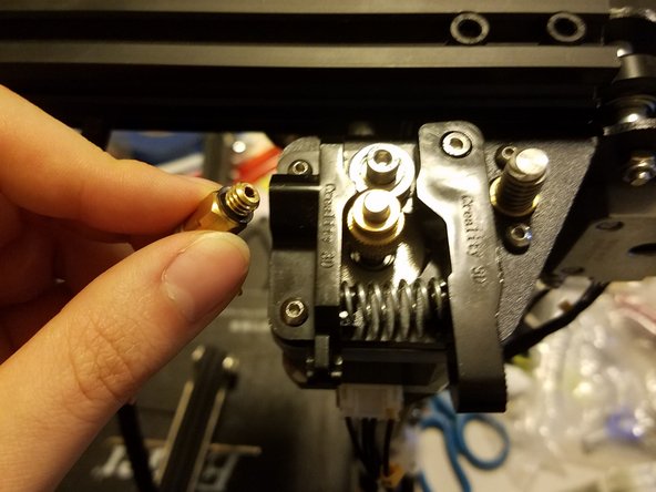 Removing the bowden coupling. (You should be able to just unscrew it by hand)