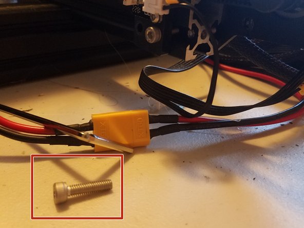You will end up with an extra screw that I recommend you keep in a safe place in case you want to undo the process (This step sacrifices a couple millimeters’ worth of print volume in order to give the motor space)