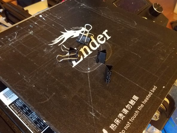 Start by removing the print bed on top of the metal panel