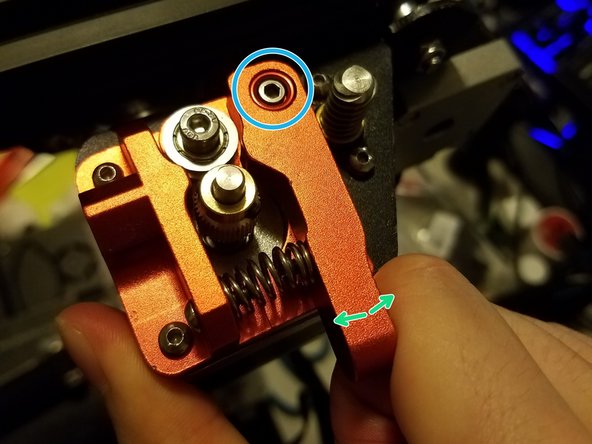 Lastly, test the mechanism by squeezing it a couple times. The arm should swing smoothly along its screw and bounce back into place. If it’s stiff, loosen the hinge screw. If the arm has space to flop up and down, tighten the hinge screw.