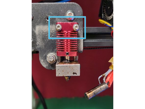 The old heater block is probably still hot enough to burn you at this point, make sure to hold onto it with something that isn't your hand