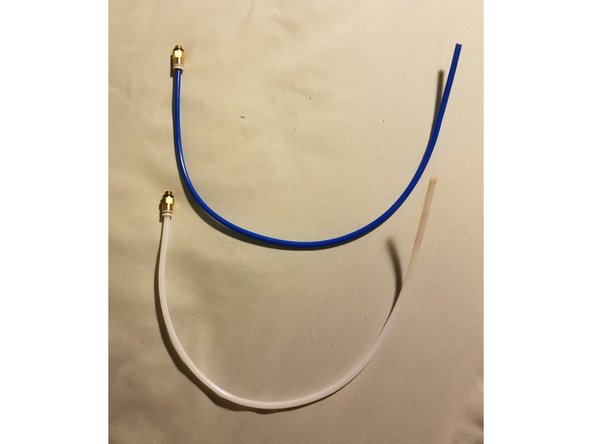 Connect the coupling to the tube by just inserting the bowden into the little plastic ring. That ring should be compressed towards the brass section and accept the tube. Both parts should now be stuck together without any space for the bowden to move in and out.