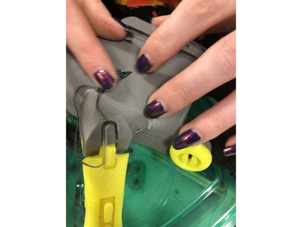 Tie off a string at the thumb and slide it in the same way as the other fingers.