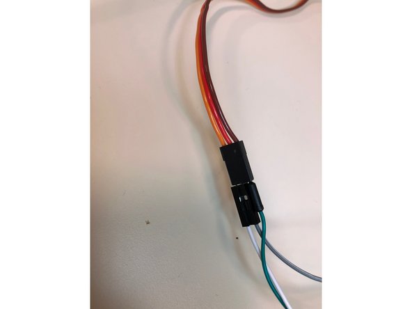 Attach a jumper wire(the thinner one with two pointed ends) from digital pin 9 to the orange colored female pin from the servo. Then, attach a male to male j. wire from the red wiring of the servo to the alligator clip from the positive end of the bench power supply and a male to male j. wire from the brown wire on the servo to the negative end.