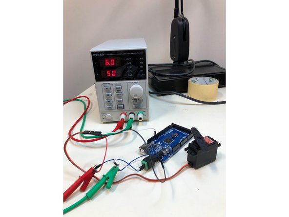 There should be two male to male jumper wires in each alligator clip, in the positive one, a j. wire from the red wire on the servo and also the positive end of the DC barrel plug. The  negative alligator clip should have two m. to m. j. wires too, from the black servo wire and negative end of DC barrel plug.