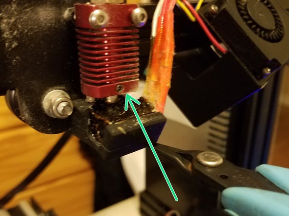 Using your pliers, gently place the heat sock over the heater block, then nudge it into place.