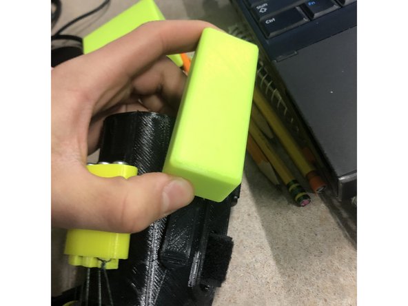 Add on the  two smaller weight blocks onto the gauntlet, you have a choice if you want to put the water filled ones (Q) on, or the solid PLA ones (S).