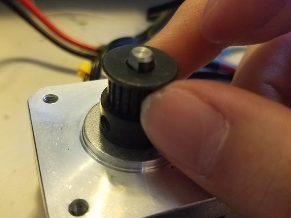 Loosen this grub screw on the stepper just enough so that the gear can be smoothly moved up and down by hand. There may be a second grub screw set at about 90 degrees from the first one, loosen that one too