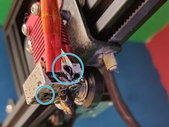 Repeat step 1 on the old heat block, loosening the indicated screws just enough that the electronics are loose in their slots