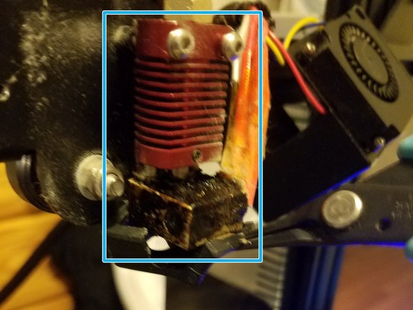 Undo the two hex bolts holding the fan housing, then swing it out and to the right to reveal the extrusion column