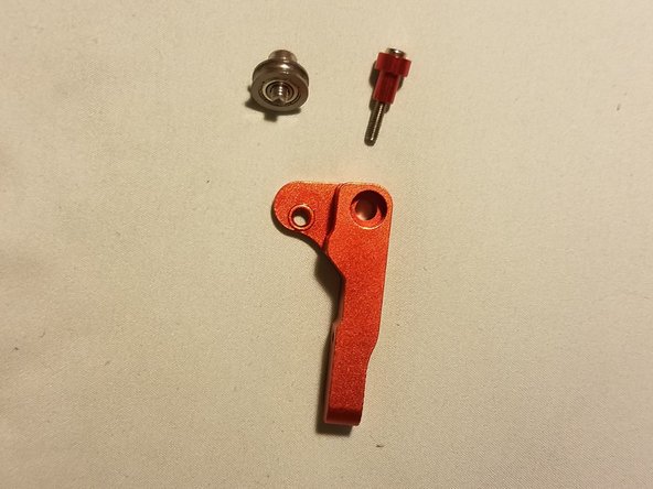 Put each screw through their respective parts as shown in these and the previous image, then place them into the arm.