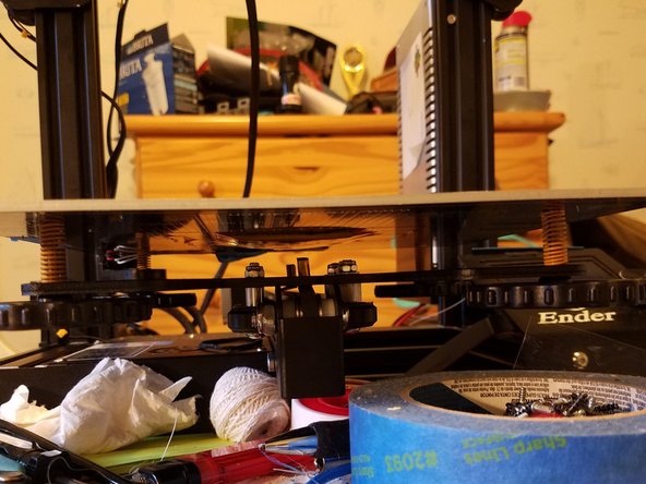 So instead of stabbing a screwdriver through the bed, just press down on each corner to relieve spring tension, then undo the corresponding adjustment knob