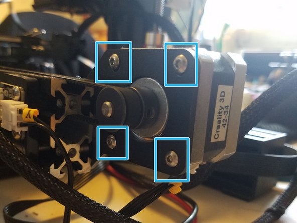 Warning: The motor is under tension from the belt, and might fly out of its bracket, off the table, and down a well if something doesn't hold it in place