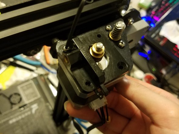 Note: The Extruder motor is held up by three screws and nothing else: Removing these screws will cause your motor to fall to the table
