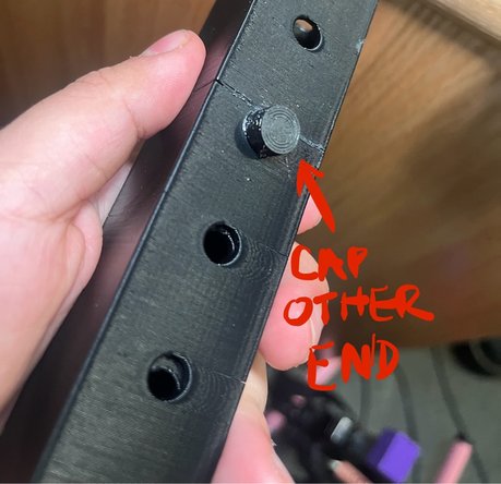 The pin can be removed to adjust the length.