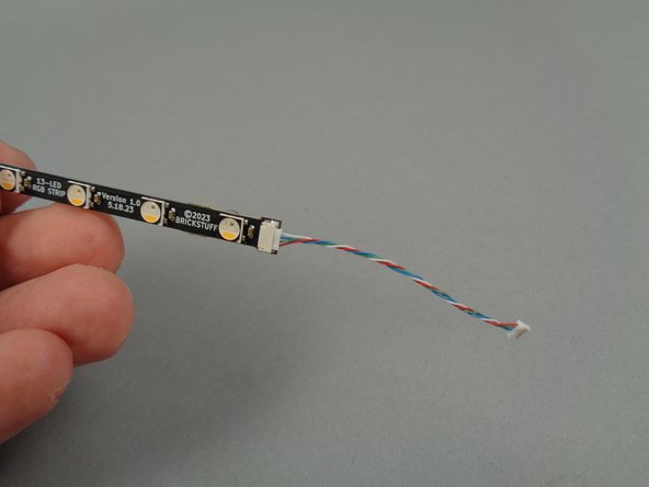 The green box shows the eight short 4-wire cables you will connect to the end of each light strip.