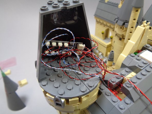 As shown in the first and second photos, place the BRANCH09X adapter board inside the space behind the half-cone, then gather all wires inside the cone area and attach the back cone section.