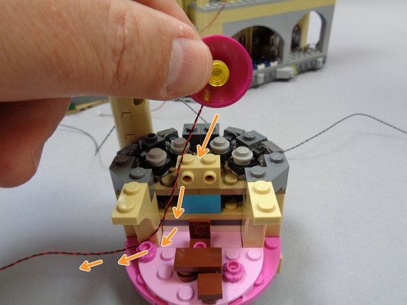 As shown by the orange arrows in the second photo, run the light wire from the dome behind the wall area, and out toward the left.